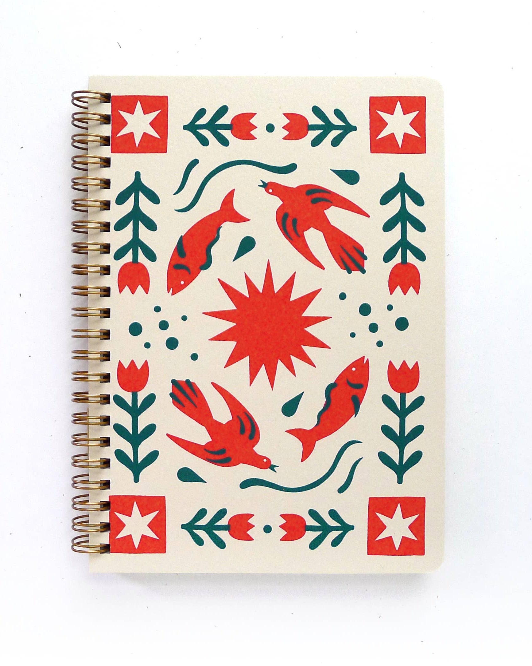 Notebook with a red and green pattern on a white background
