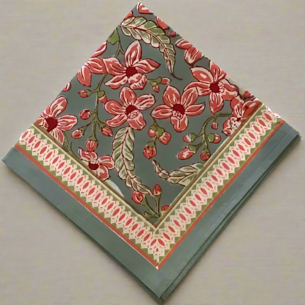 Decorative square folded napkin with floral pattern