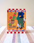 Card with illustration of a person watering plants, dog, and cat with text &