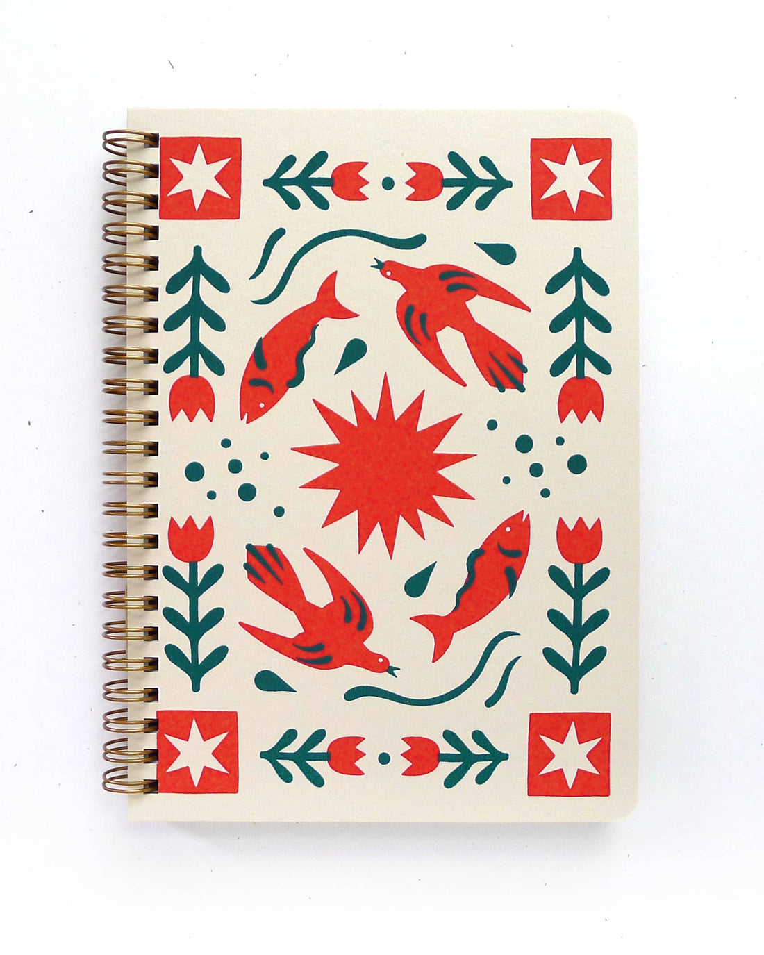 Notebook with a red and green pattern on a white background