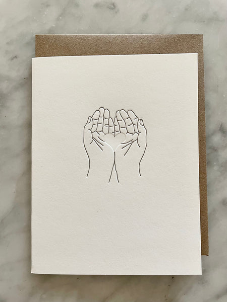 Hands Holding Heart Card